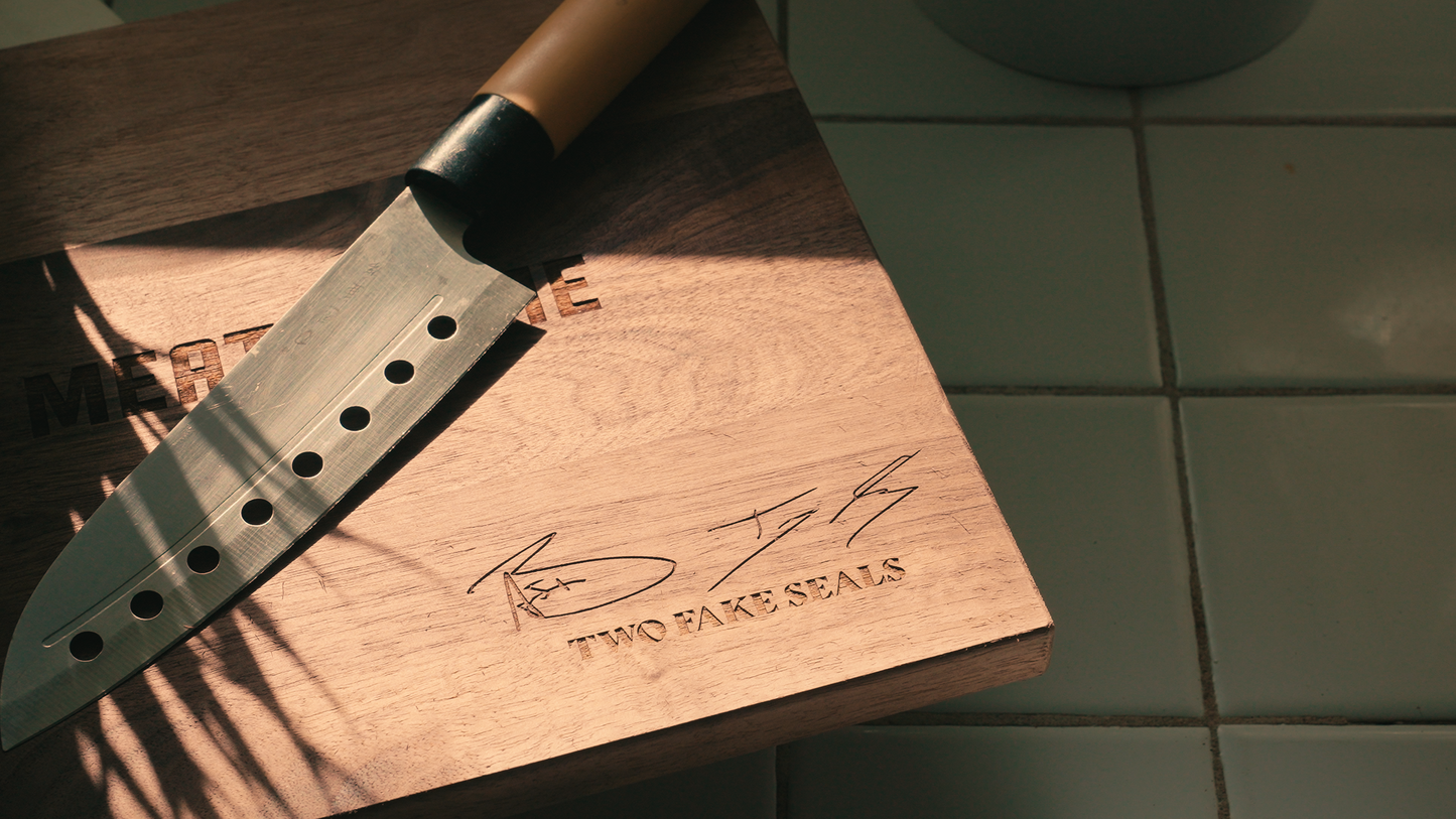 Two Fake Seals ‘Slap Your Meat On Me’ Walnut Cutting Board