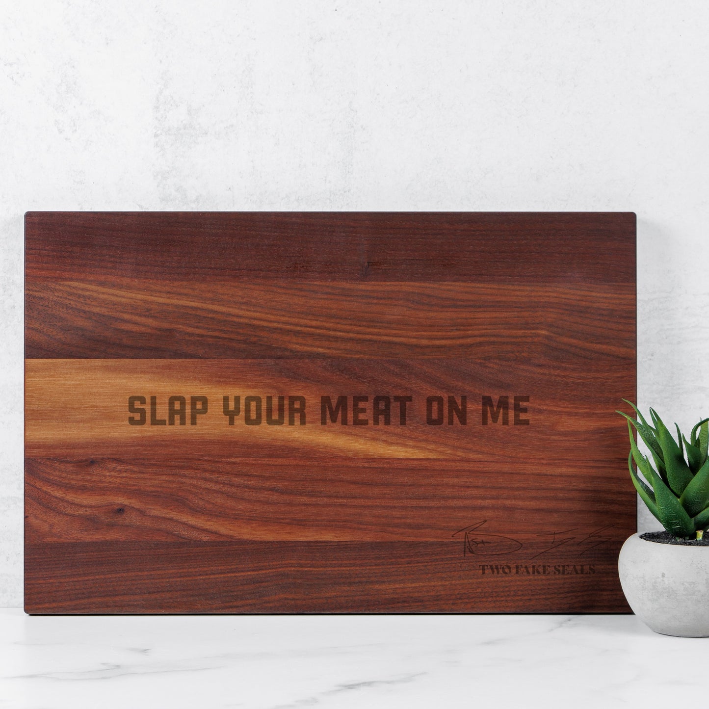 Two Fake Seals ‘Slap Your Meat On Me’ Walnut Cutting Board