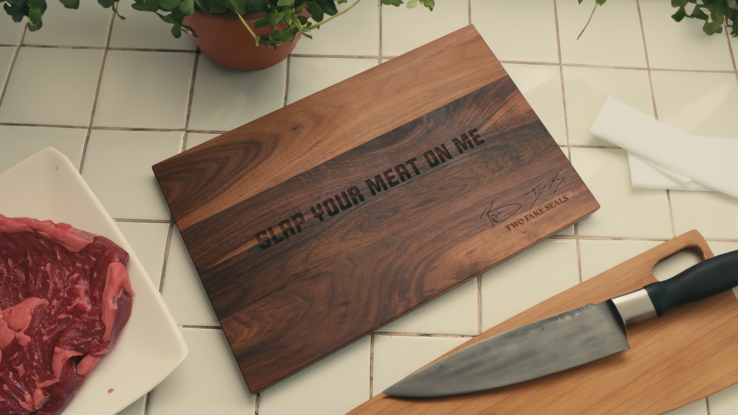 Two Fake Seals ‘Slap Your Meat On Me’ Walnut Cutting Board